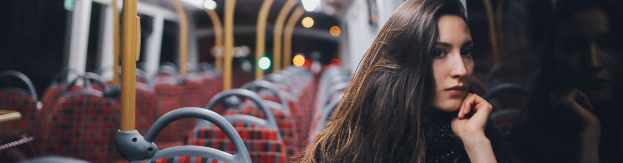 Women on a busy on her own in the dark