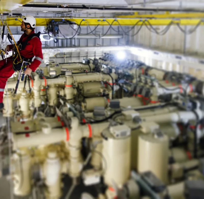 Technician making inspection of crane railing