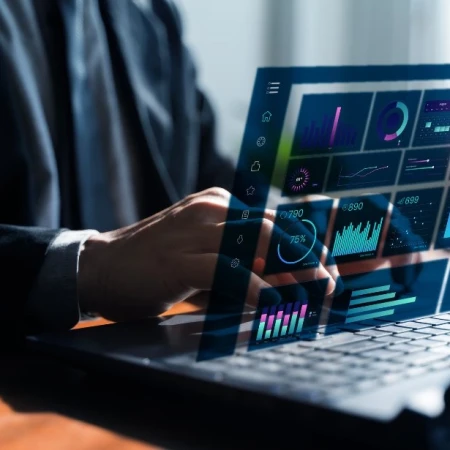 Operator viewing a live data dashboard on a laptop