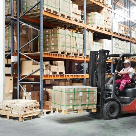 Forklift operator working in a warehouse