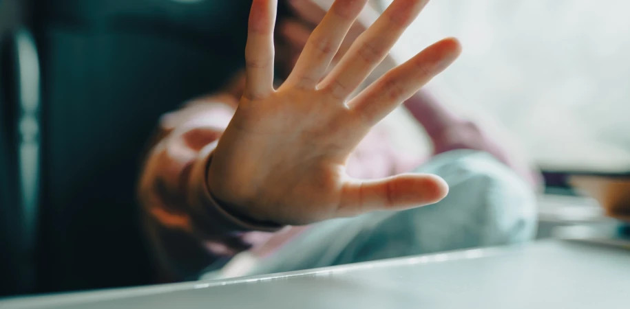 Defensive gesture of hands against violence