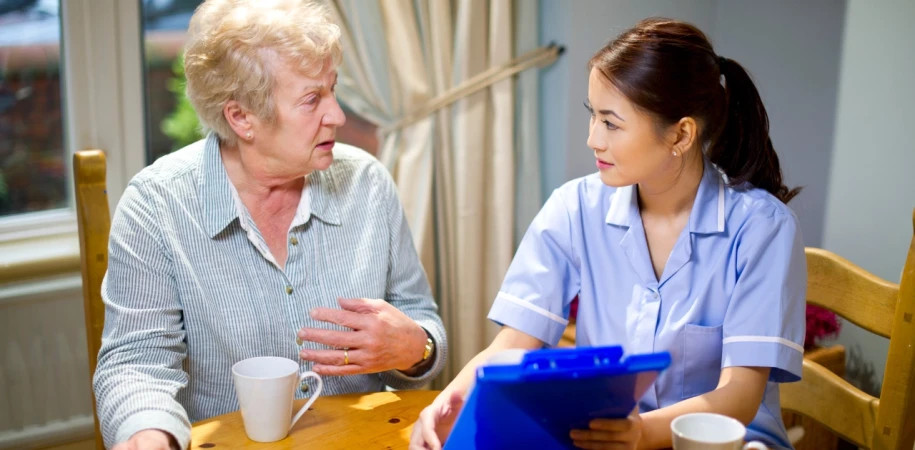 Nurse with patient at home