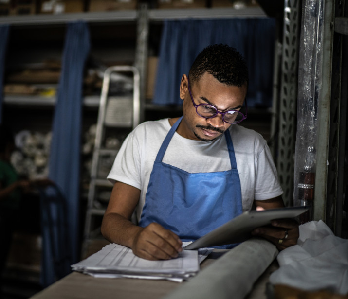 Male retail workering in a storage room