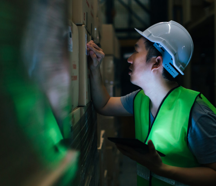 Male Warehouse Worker using Tablet