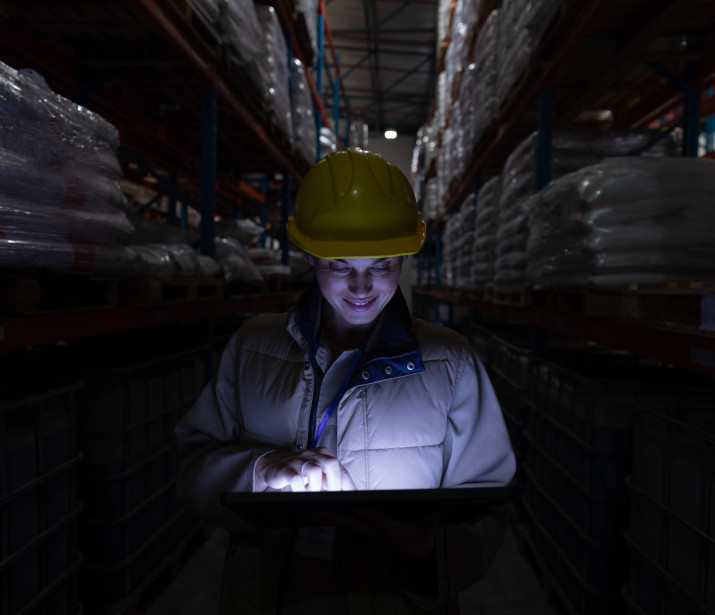 Female Warehouse Worker using Tablet