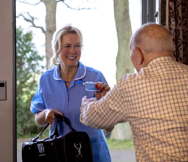 Community Nurse arriving at male patients home