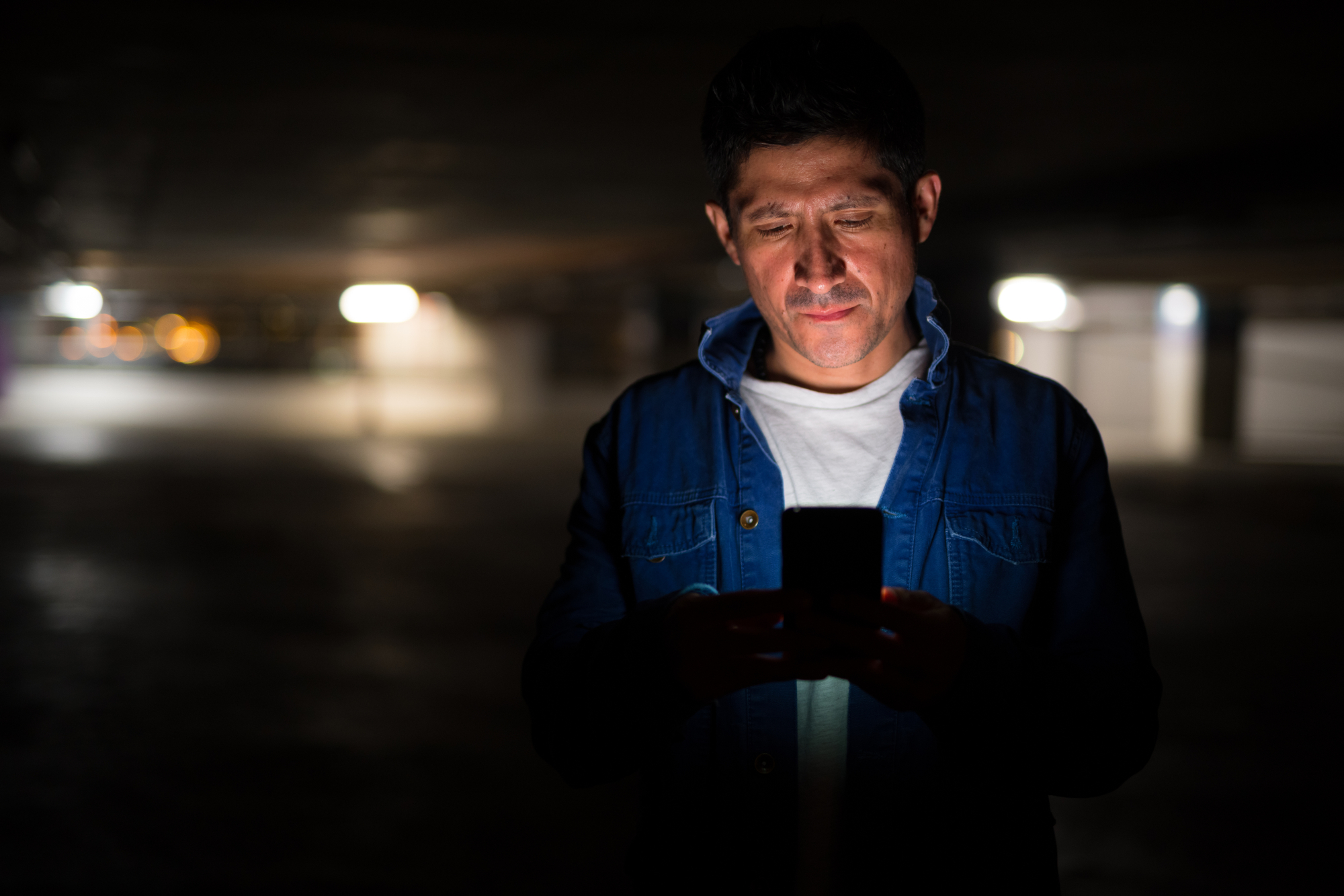 Man using phone at night